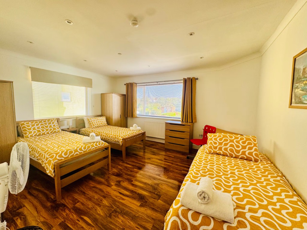 Bedroom with three single beds