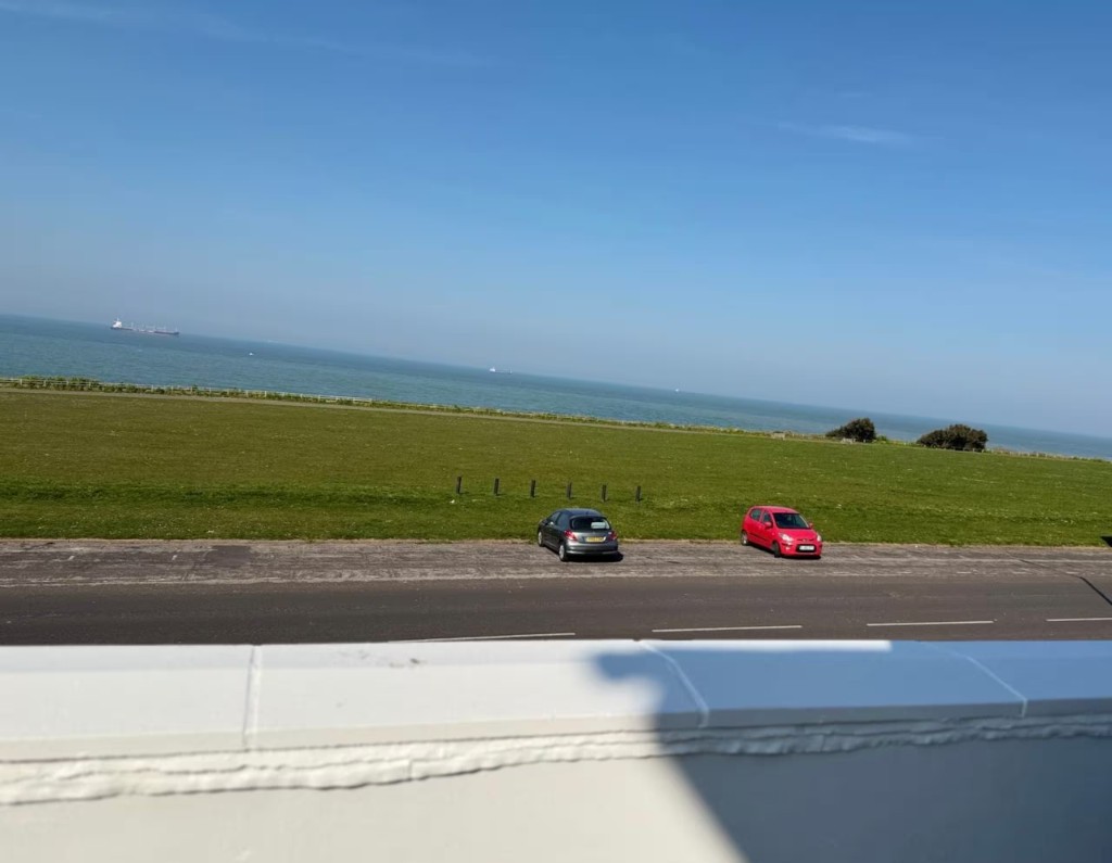 The green and the sea, seen from the flat on Palm Bay Avenue
